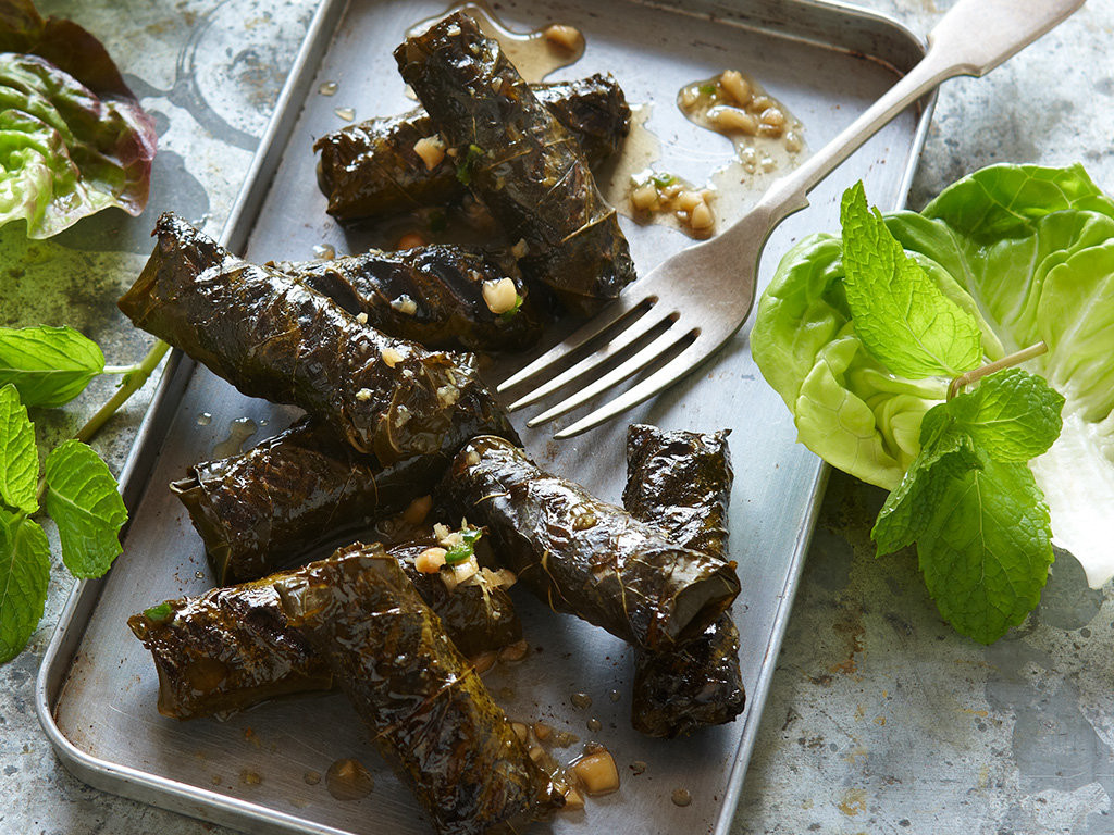 Grilled beef in vine leaves